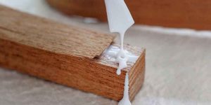 How to Glue Material to Wood