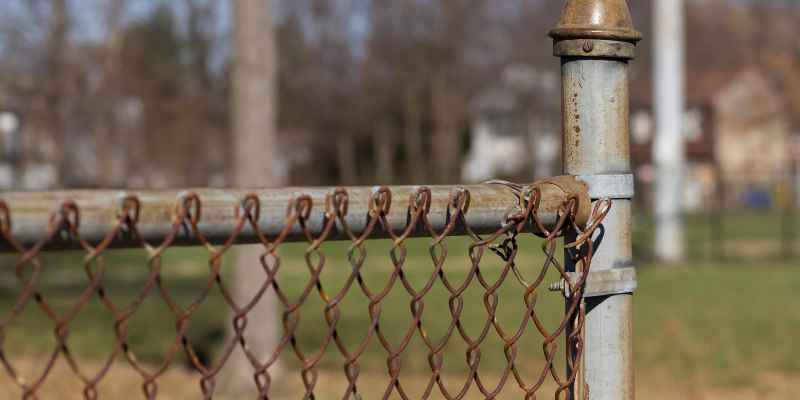How to Attach Chain Link Fence to Wood Post