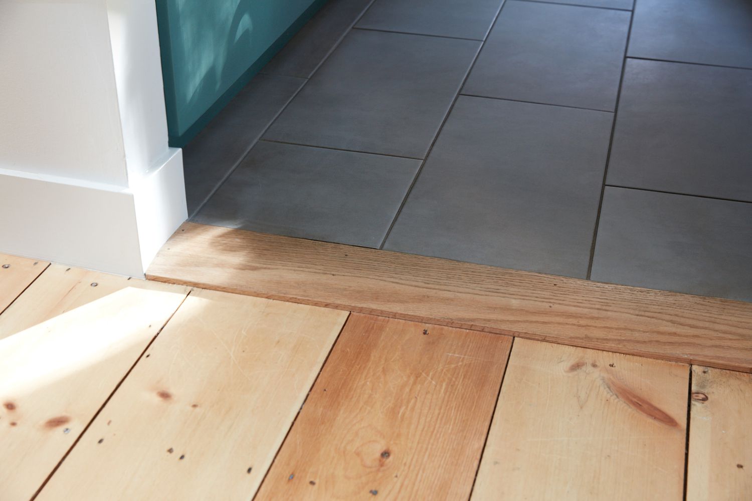 Threshold between Wood And Tile