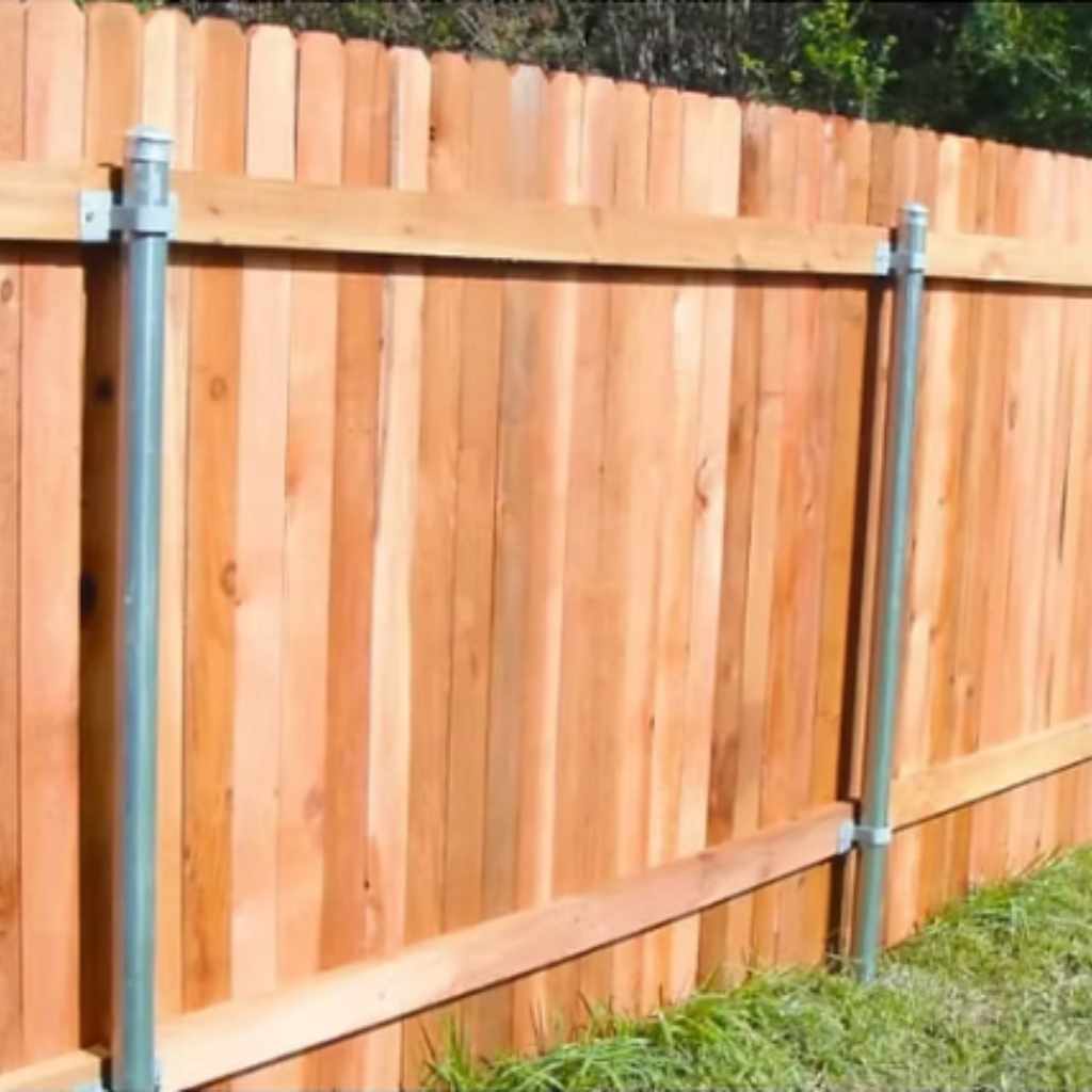 How to Build a Wood Fence Using Metal Posts